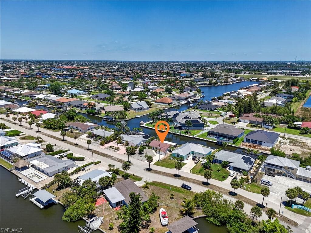 Home overlooks expensive homes in Cape Coral including one worth over $2M.