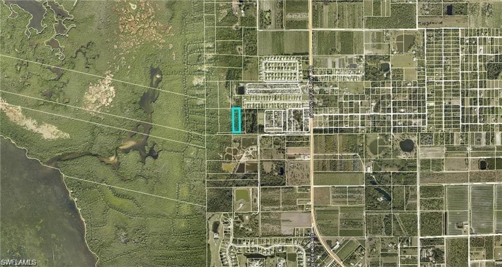 Aerial Map. Illustrating the property's location relative to surrounding land parcels and natural features