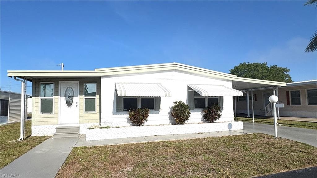 Welcome to lovely Lazy Days Village where you own your land AND this beautiful home!