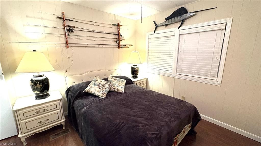 Second Bedroom features wood-finish flooring.
