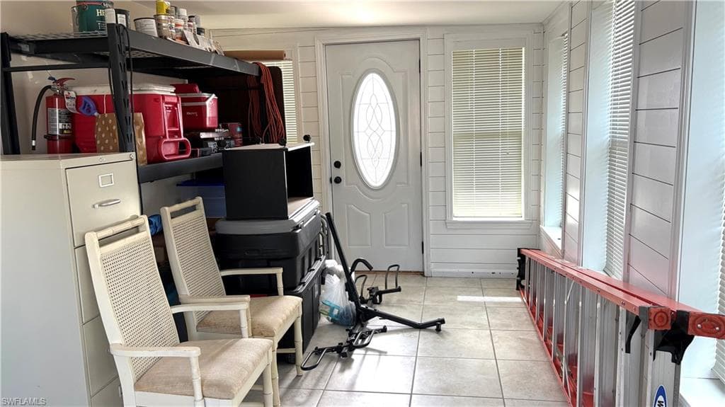 The spacious Florida room features a new entry door and new windows.