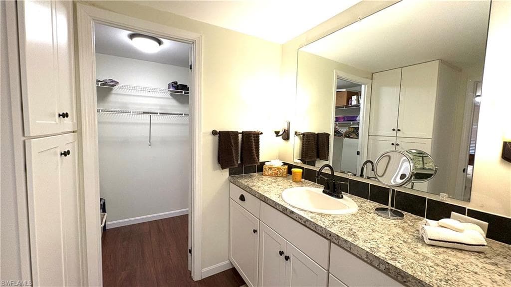 The Primary Bathroom has lots of storage space and an adjacent walk-in closet.