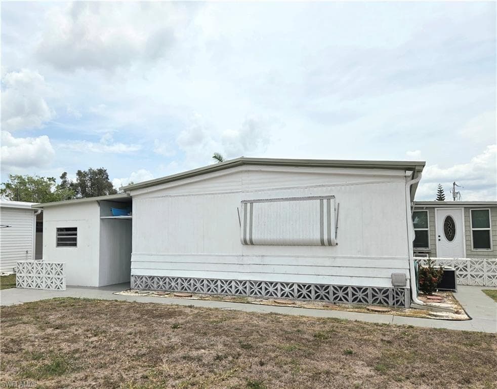 Rear of unit shows the back door off the Florida room.