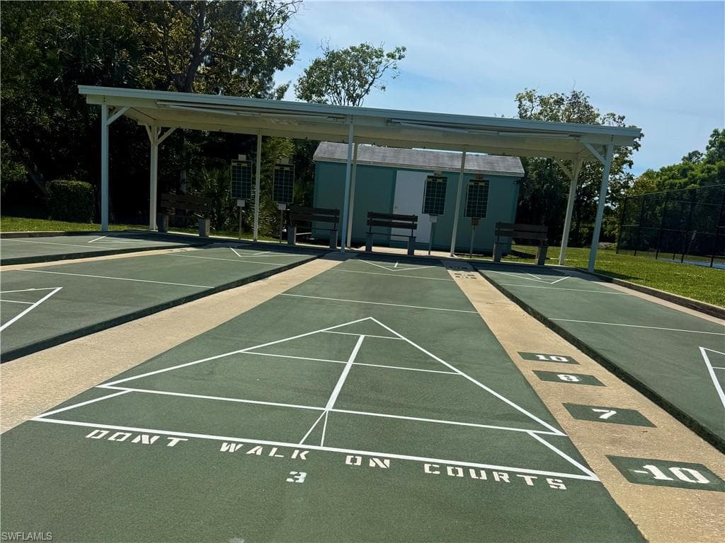 Shuffleboard courts with green playing surfaces and white markings