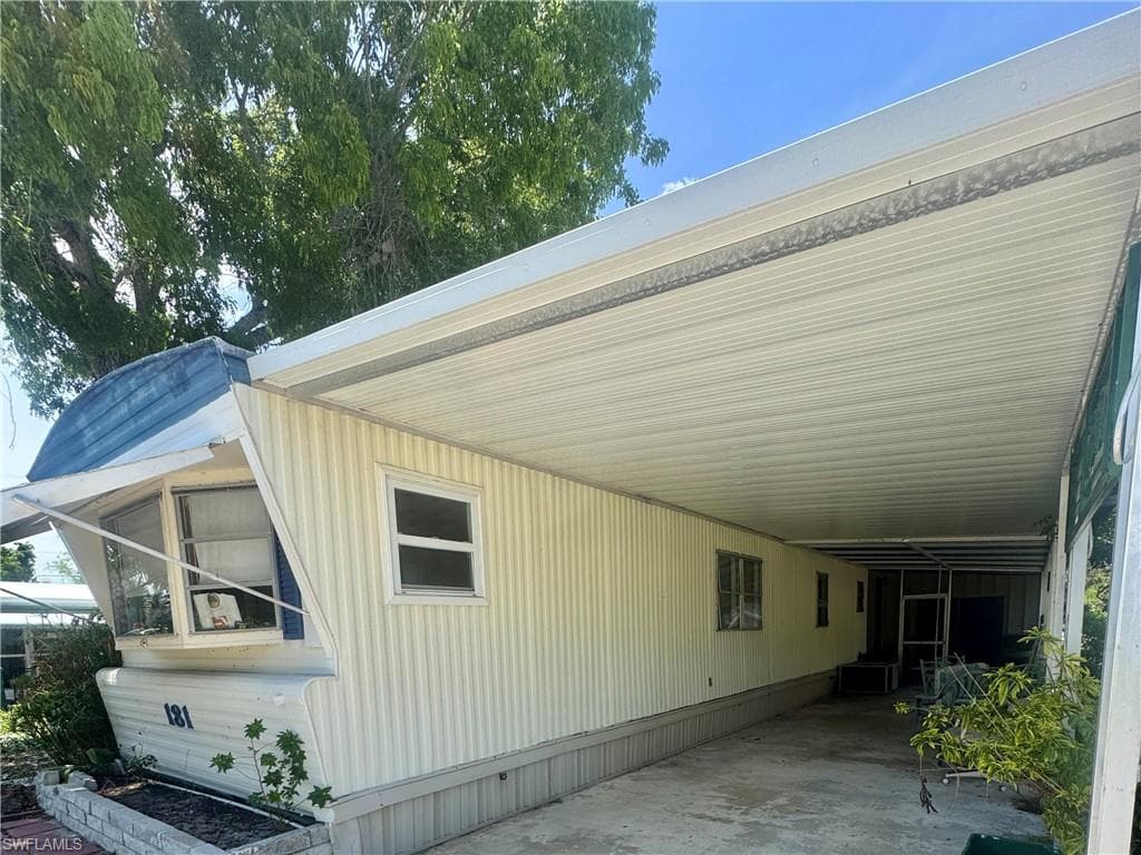 Expansive carport providing covered parking