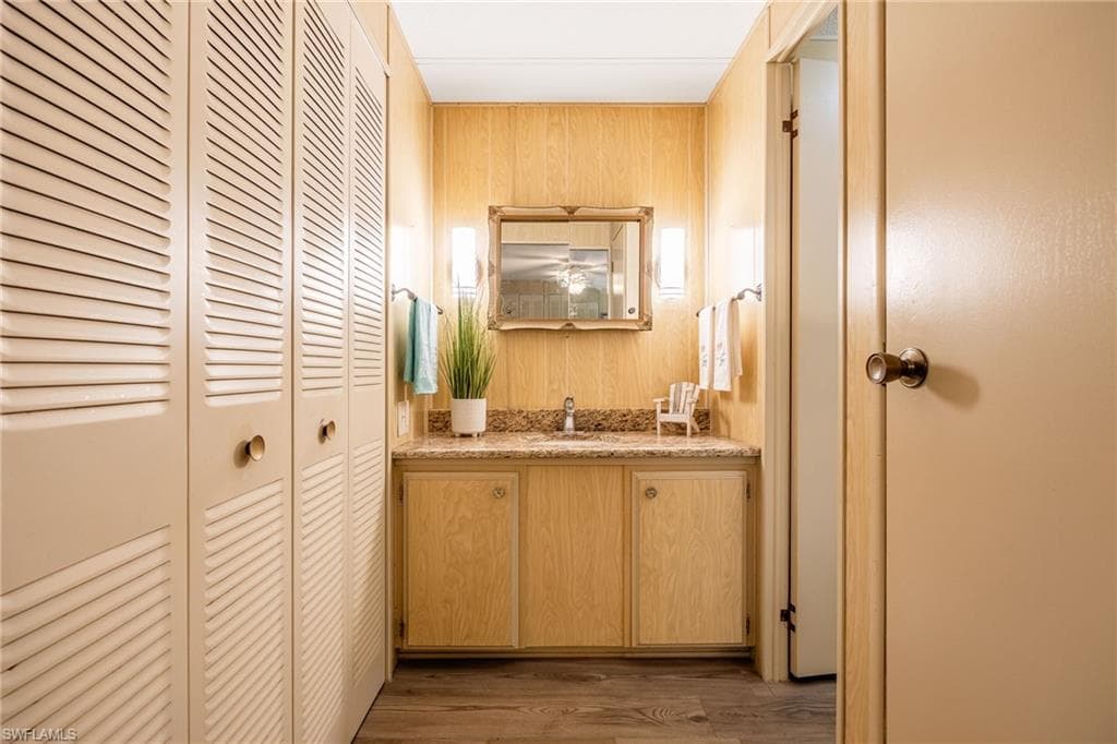 Closet on left and linen closet on right. Sink and prep area are outside the private shower and toilet.