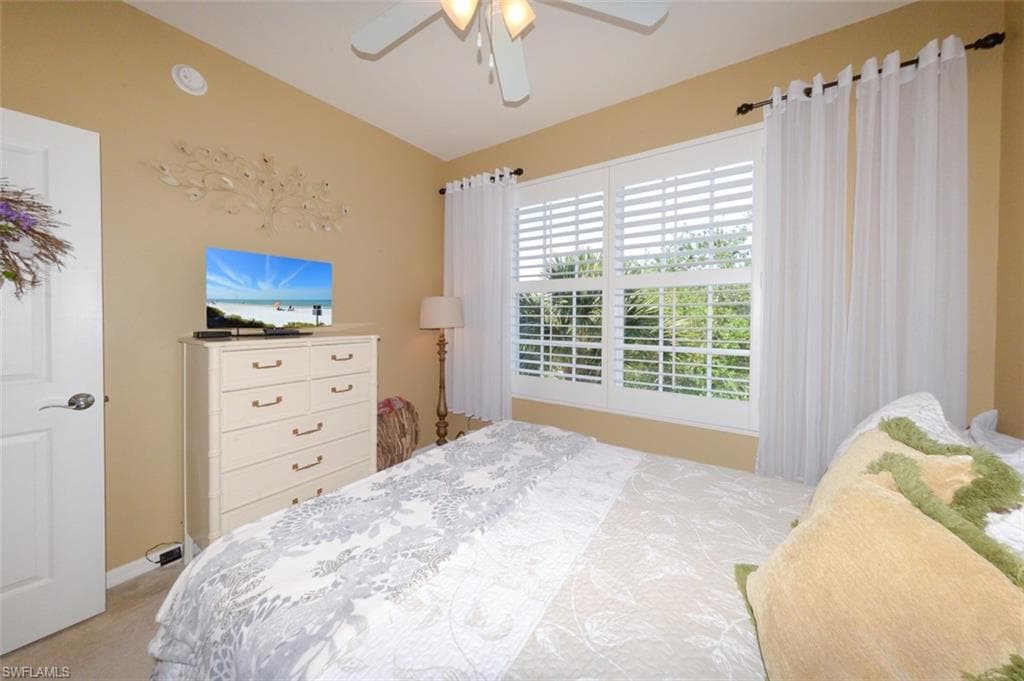 Spacious Guest bedroom with Plantation shutters.
