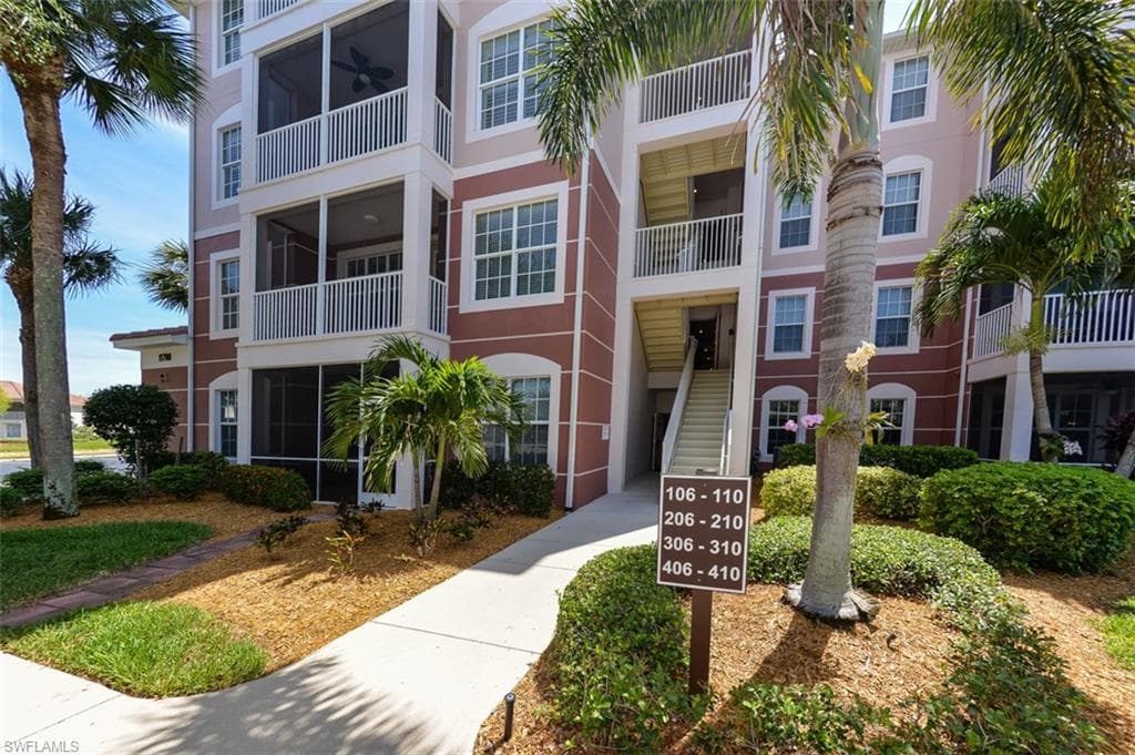 Entry to building leads to elevator inside. Well maintained building and landscaping.