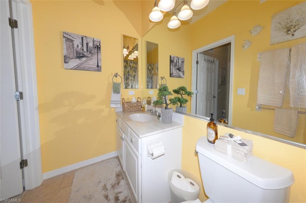 Guest Bathroom with full tub and shower, Tiled floor and upgraded lighting.