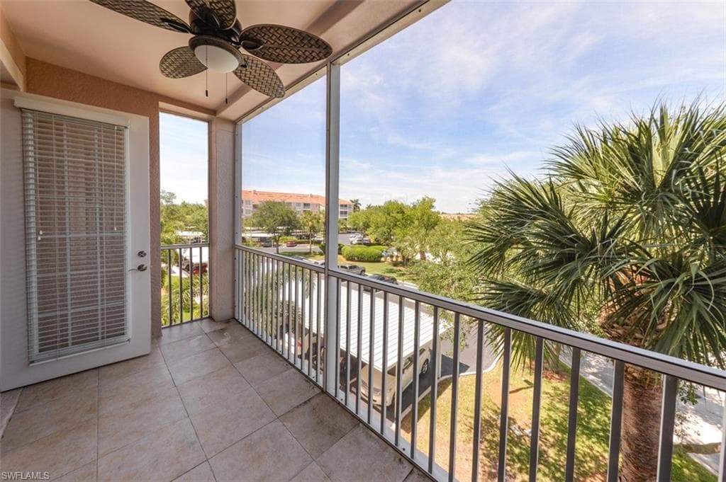 Covered and screened Lanai with view of Landscaped area and trees.