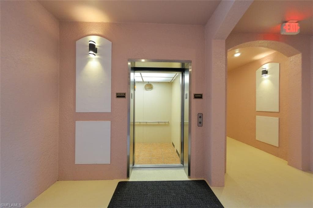 Building elevator inside first floor hallway.