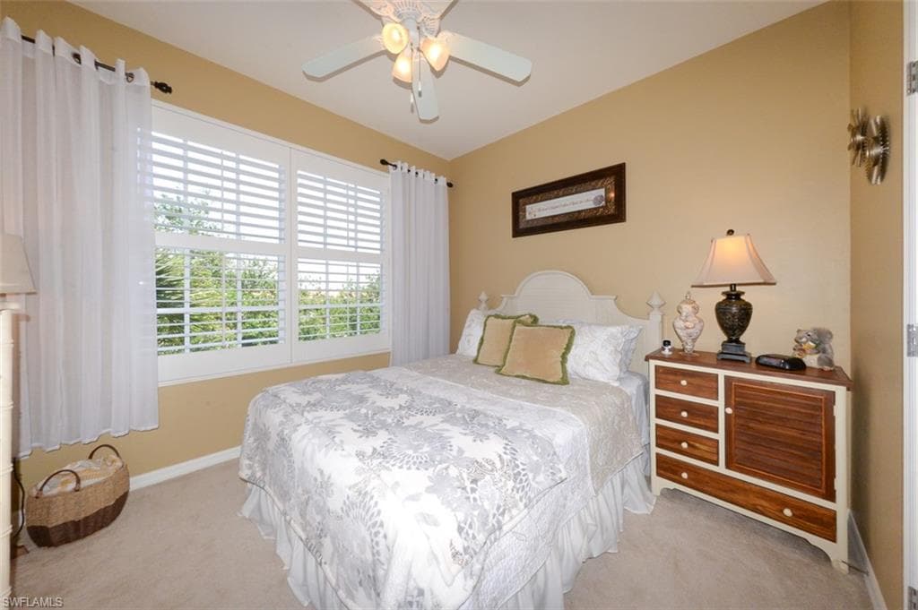 Spacious Guest bedroom with Plantation shutters.