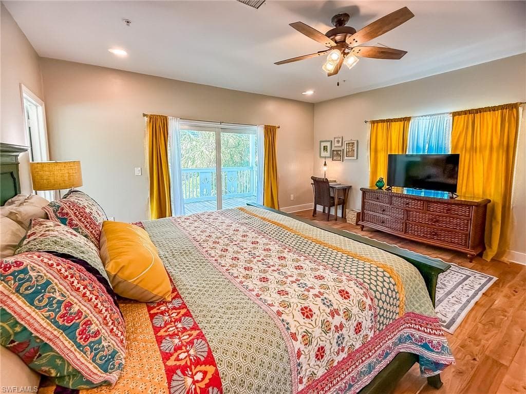 Bedroom with access to outside, wood finished floors, recessed lighting, baseboards, and ceiling fan