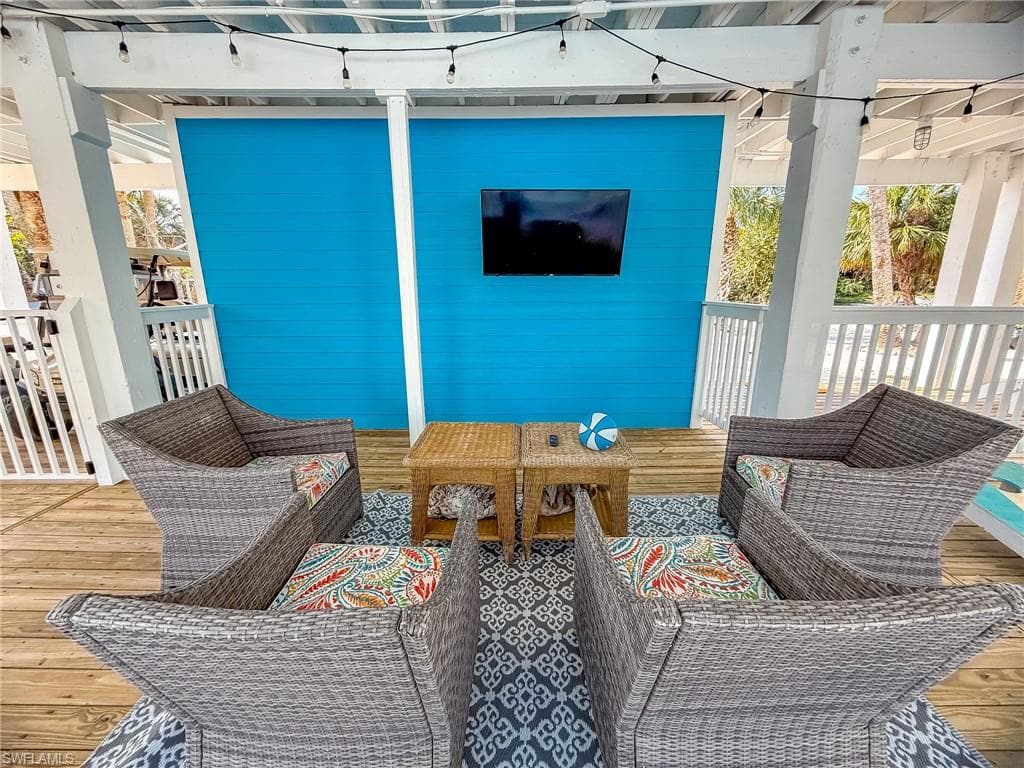 View of patio featuring outdoor lounge area and a deck