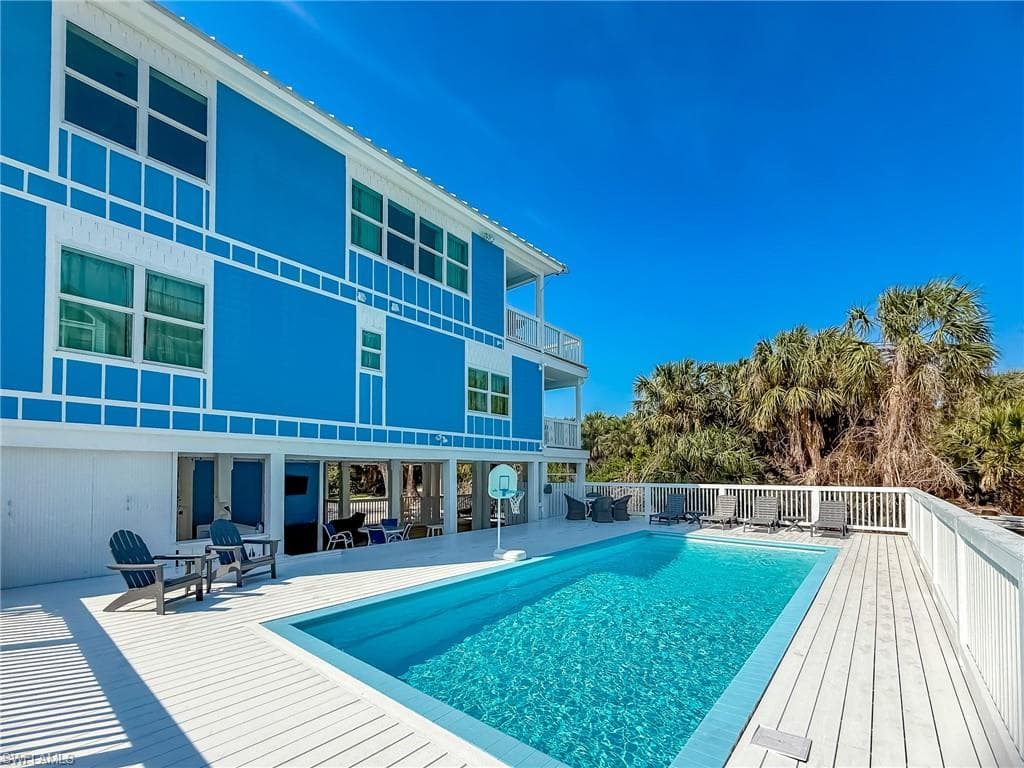 View of pool with a patio area and a fenced in pool