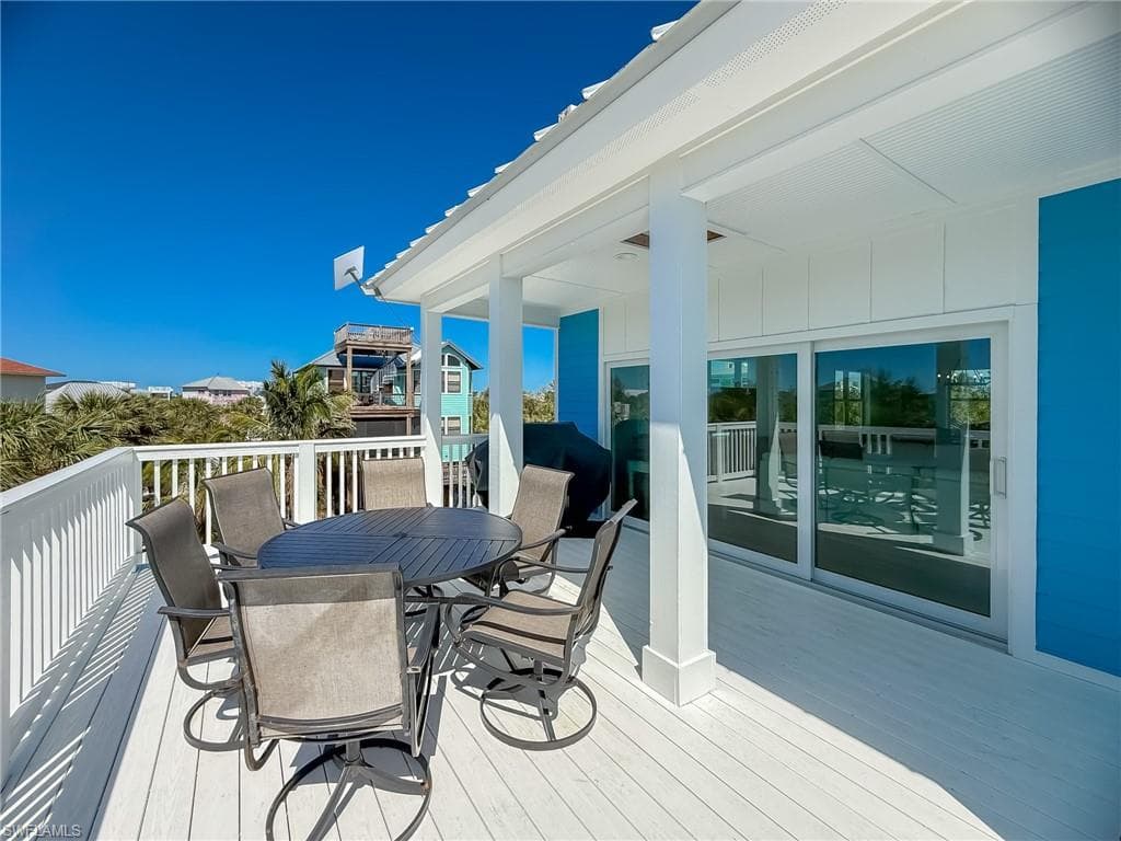 Wooden terrace with outdoor dining area