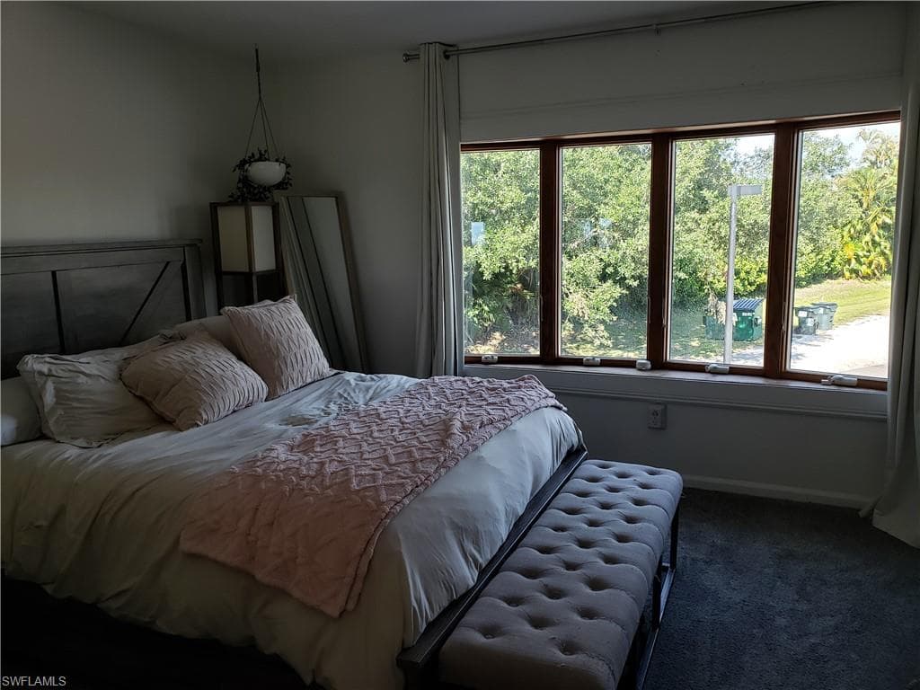 Bedroom 1 is large with the beautiful window area that overlooks the back open space.