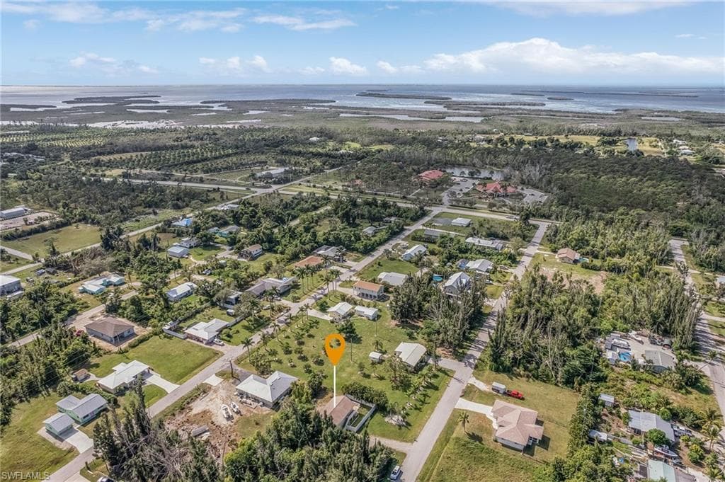Aerial perspective showcasing a residential area with varied housing styles and ample green space