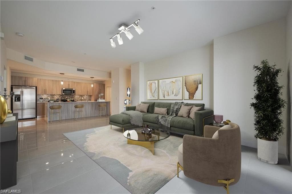 Living area with visible vents and light tile patterned floors