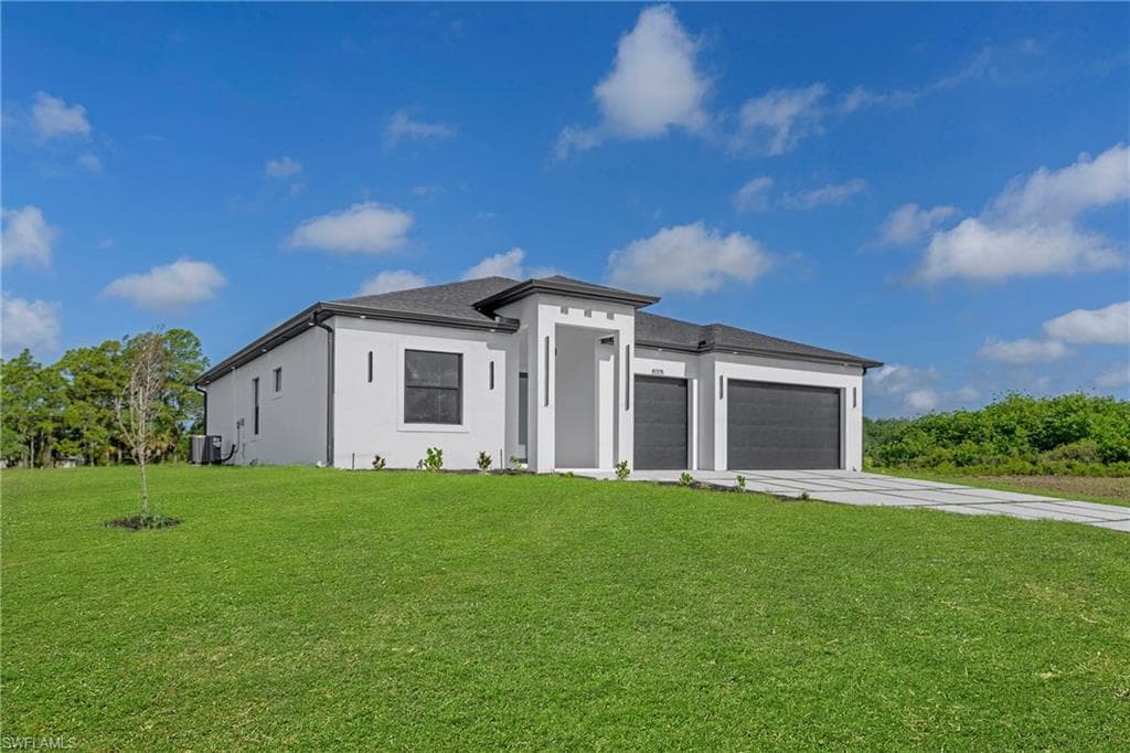 Contemporary single-story residence with a stucco exterior and dark shingle roof