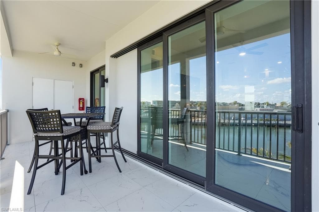 Balcony featuring a water view - Virtually Edited Image