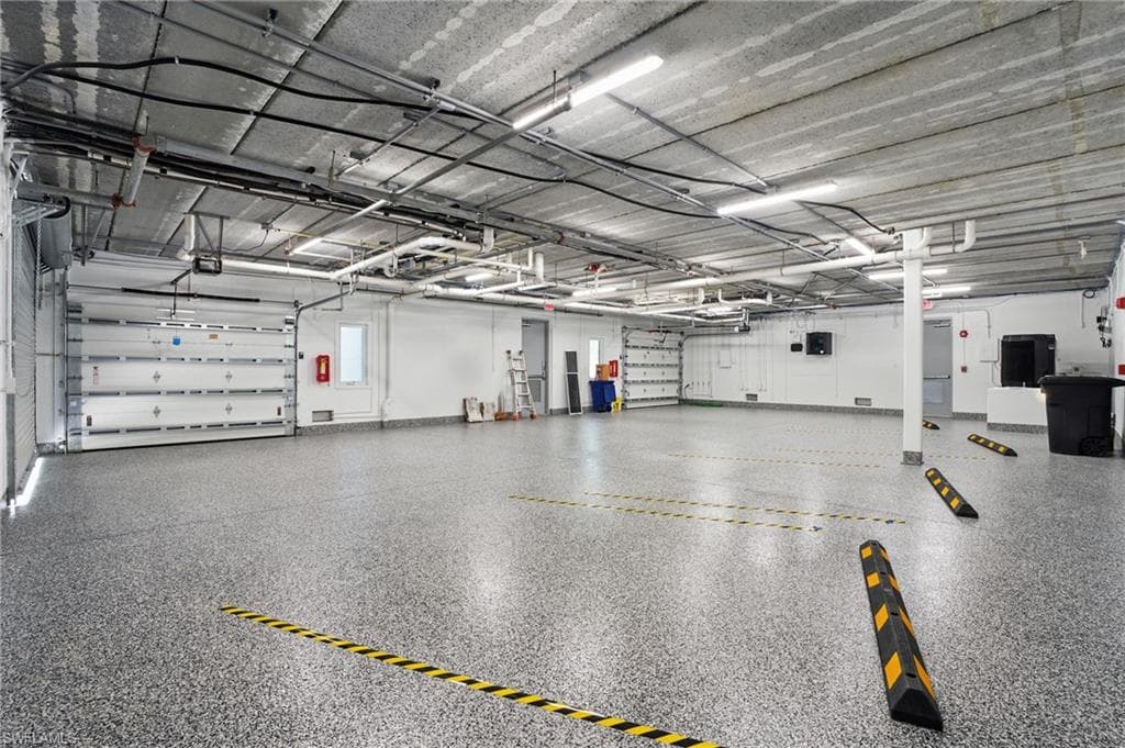 BEAUTIFUL EPOXY FLOOR + ENCLOSED GARAGE PARKING SPACES - VIRTUALLY EDITED