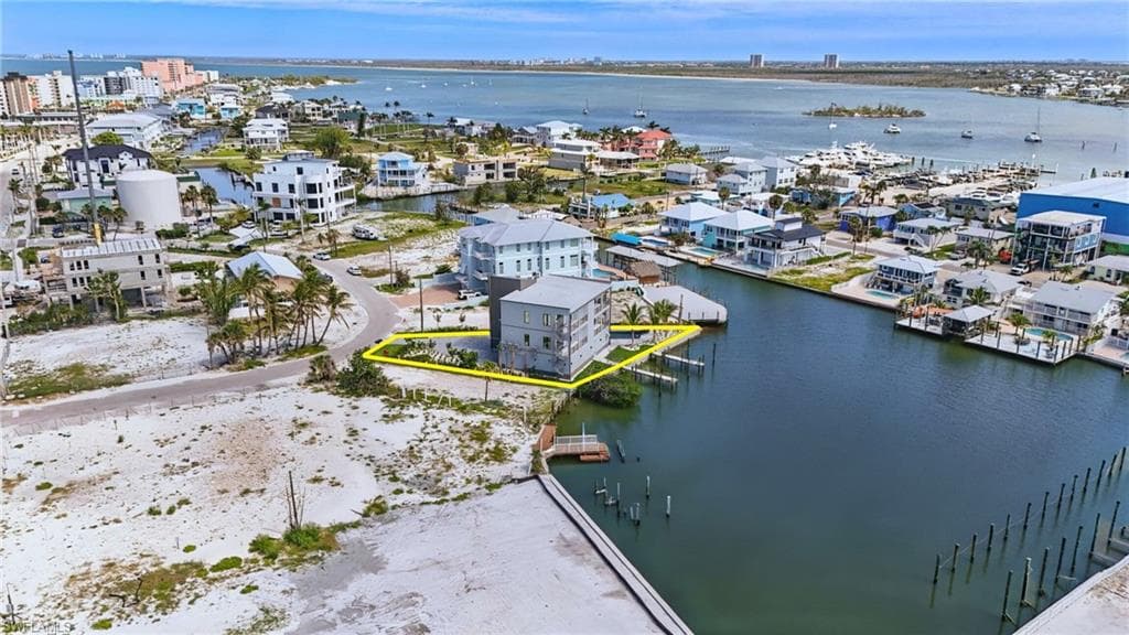 Bird's eye view of property on lagoon - VIRTUALLY EDITED