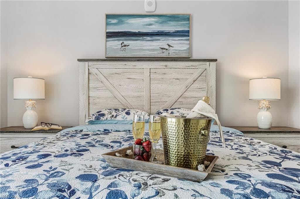 Bedroom featuring a distressed wood-finish headboard and matching nightstands - Virtually Edited Image