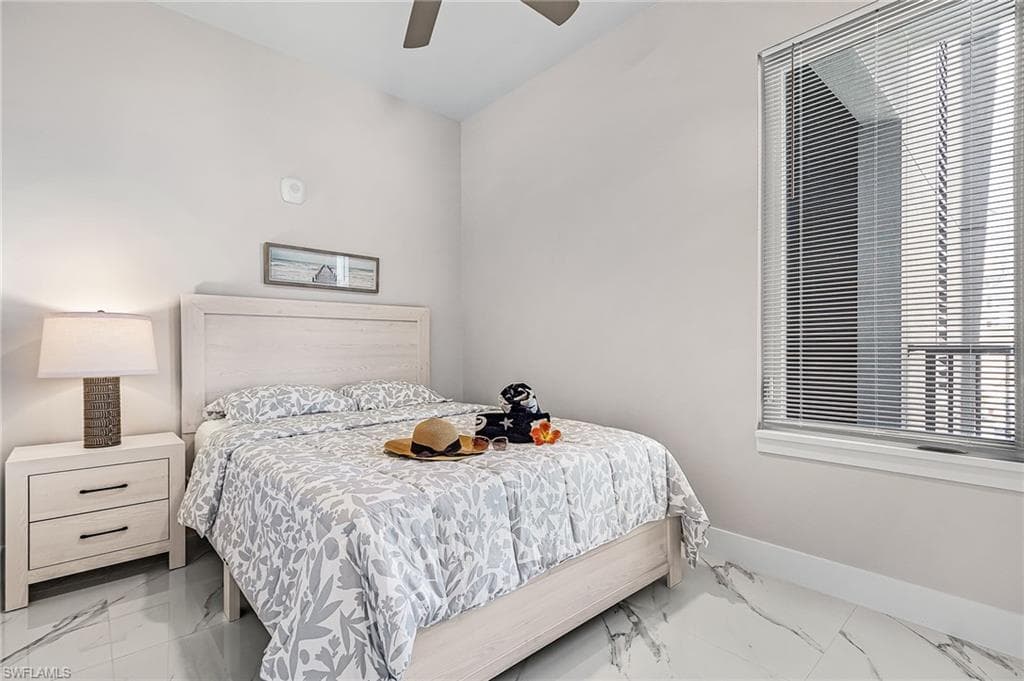 Light-toned wood-finish bed frame with matching two-drawer nightstand - Virtually Edited Image