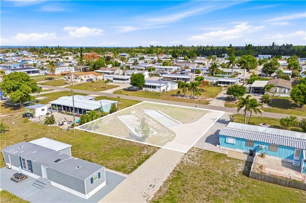 Expansive land lot featuring a cleared building envelope and existing paved driveway
