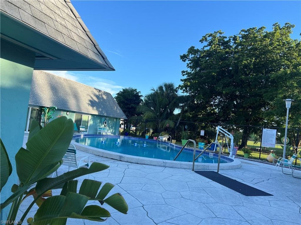 Community pool with a patio area