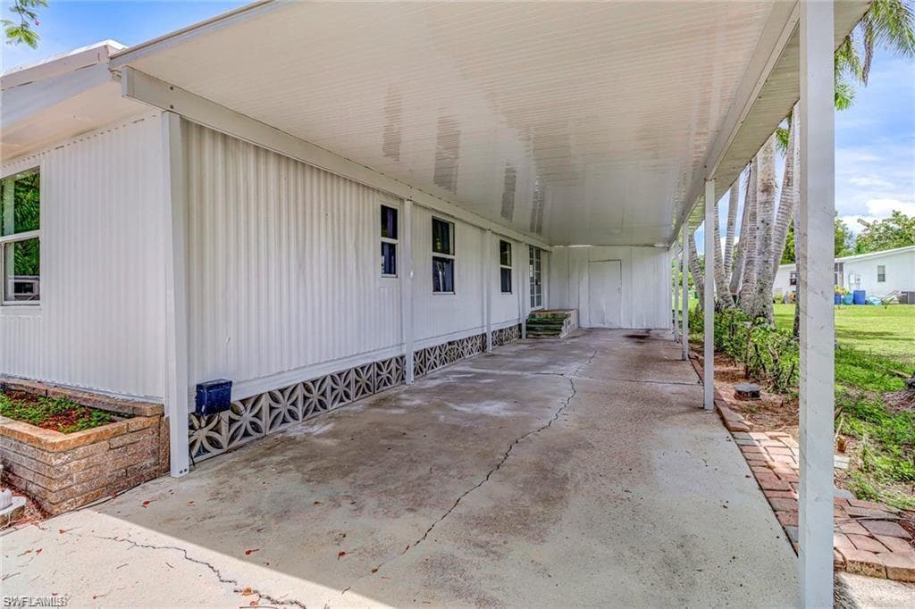View of patio featuring a carport