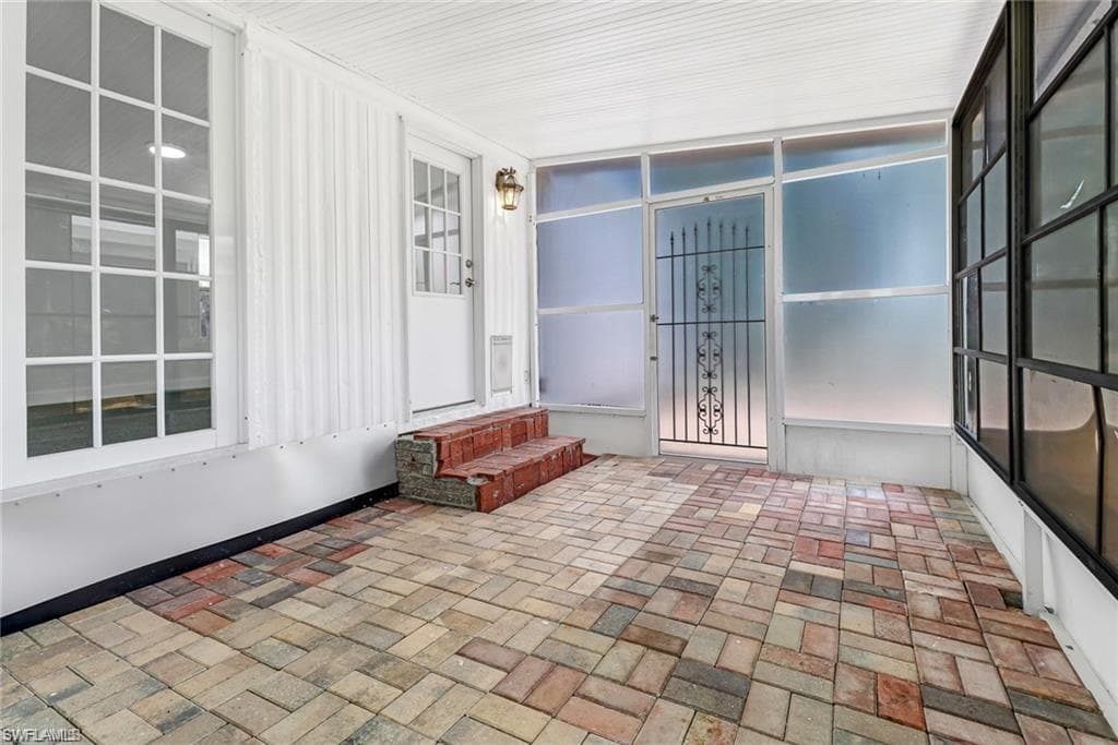 Sunroom with brick patterned floors