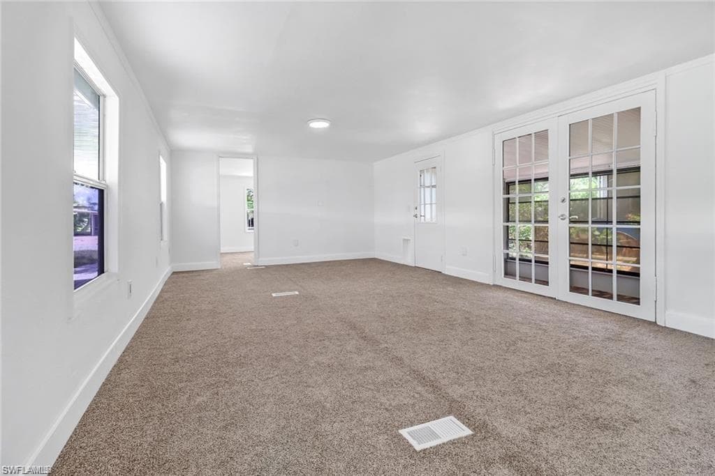 room featuring carpet floors and baseboards