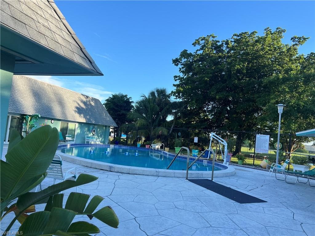 Community pool with a patio area