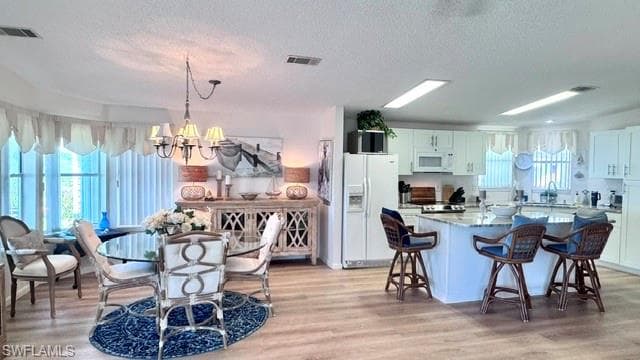 Open-concept living area featuring wood-finish flooring throughout
