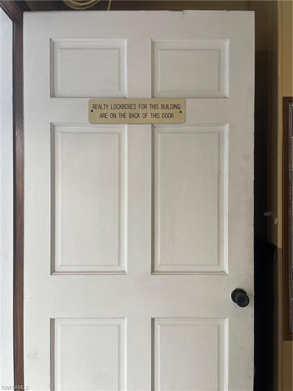 This wood door is before the entrance glass door