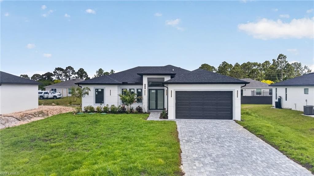 Modern single-story residence with a dark asphalt shingle roof