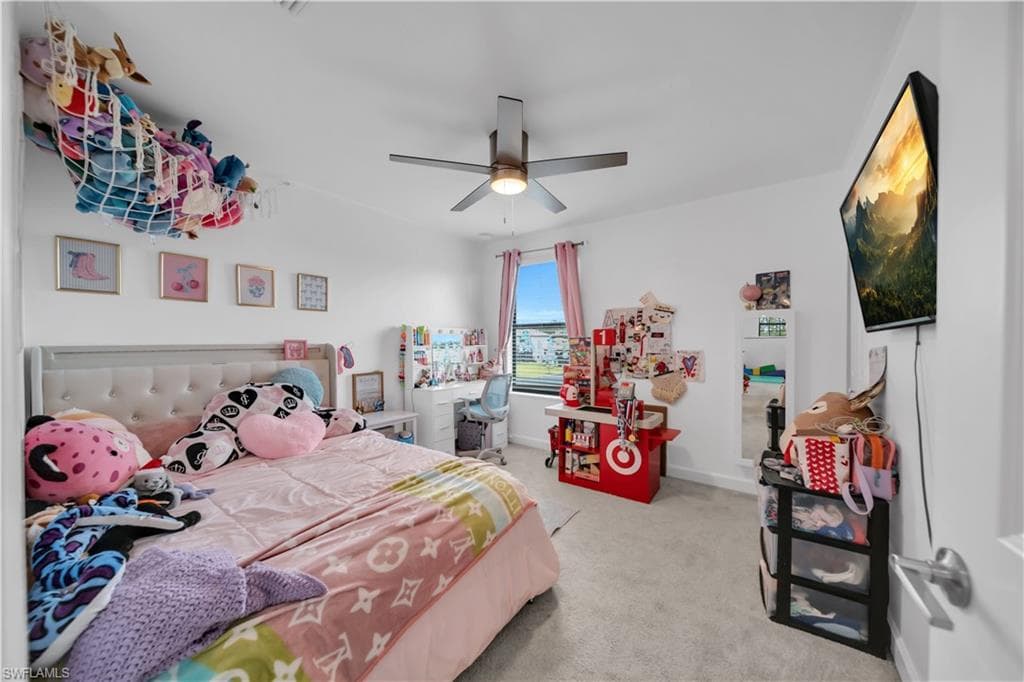 2nd Bedroom with ceiling fan and walk-in closet