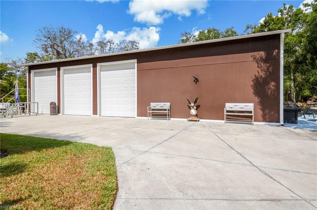 Pole Barn with 4 Garage Access Points and Full Bathroom.