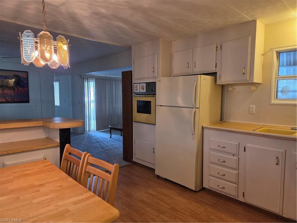 All appliances convey. View from your kitchen past the breakfast bar into your living room.