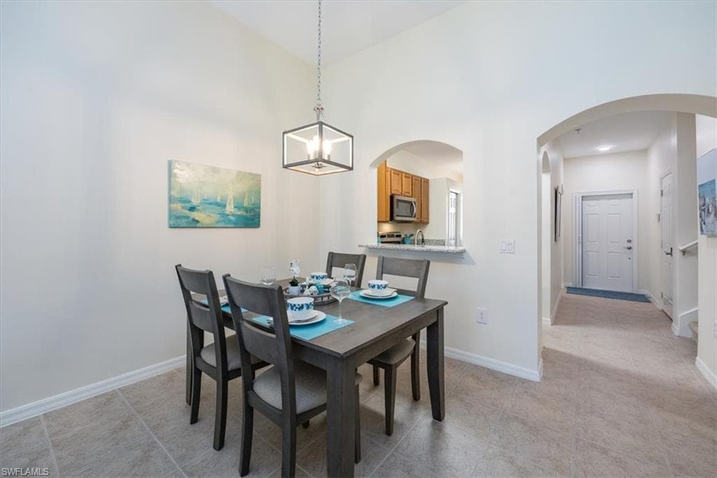 Dining Room with opening to Kitchen and new chandlier
