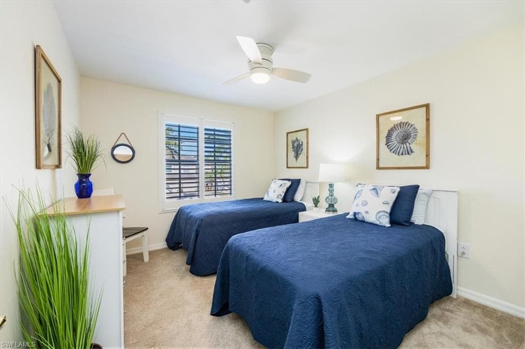 2nd Guest Bedroom w/new ceiling fan, plantation shutters and walk in closet