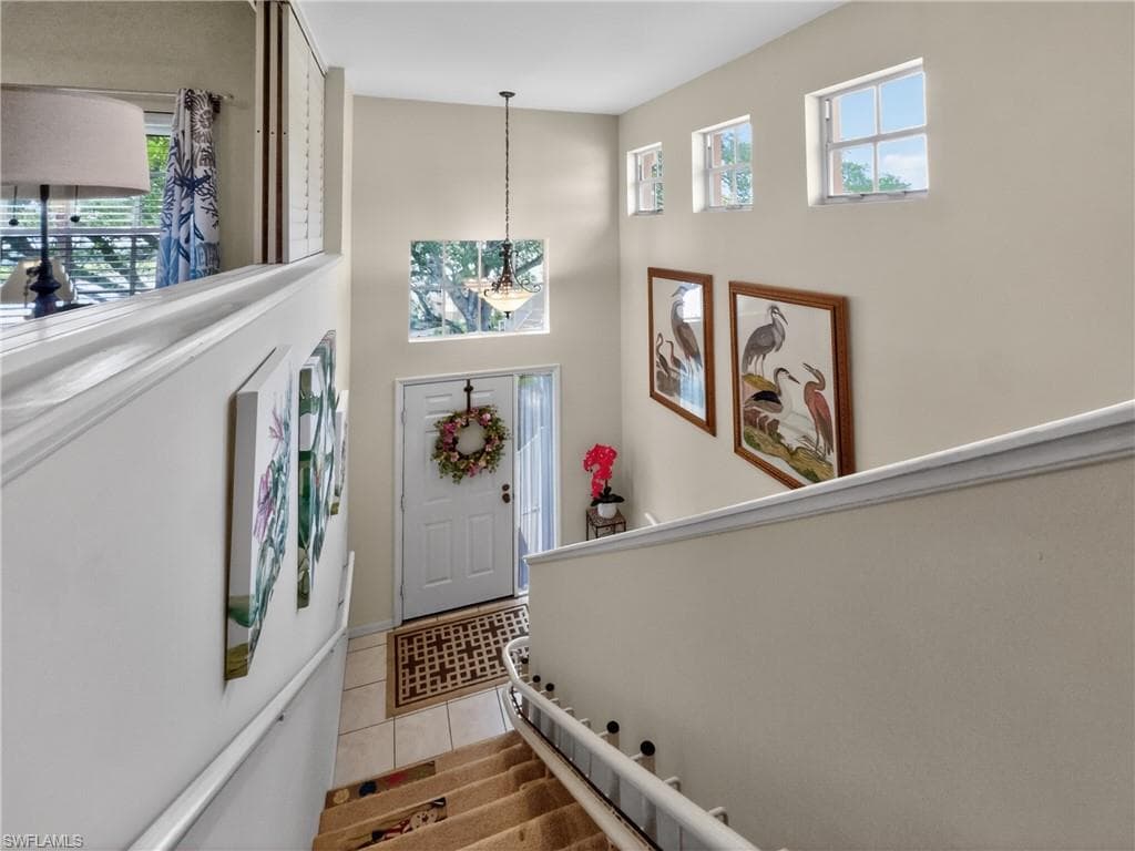 Front entrance and staircase to second floor with electric chair/seat. Great for packages and groceries too!