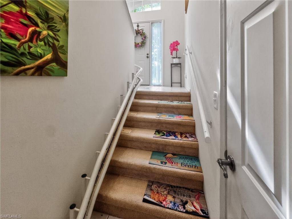 Staircase from Garage with electric seat to second floor of Condo.
