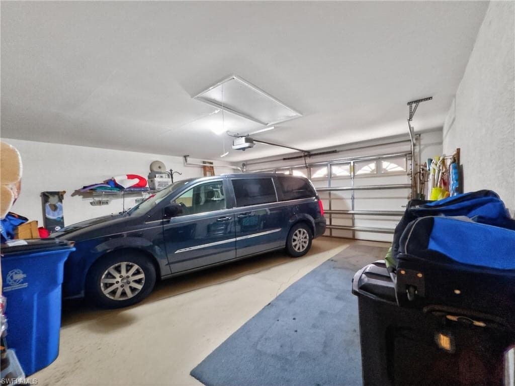 Two Car garage with automatic opener and pull-down stairway to overhead storage