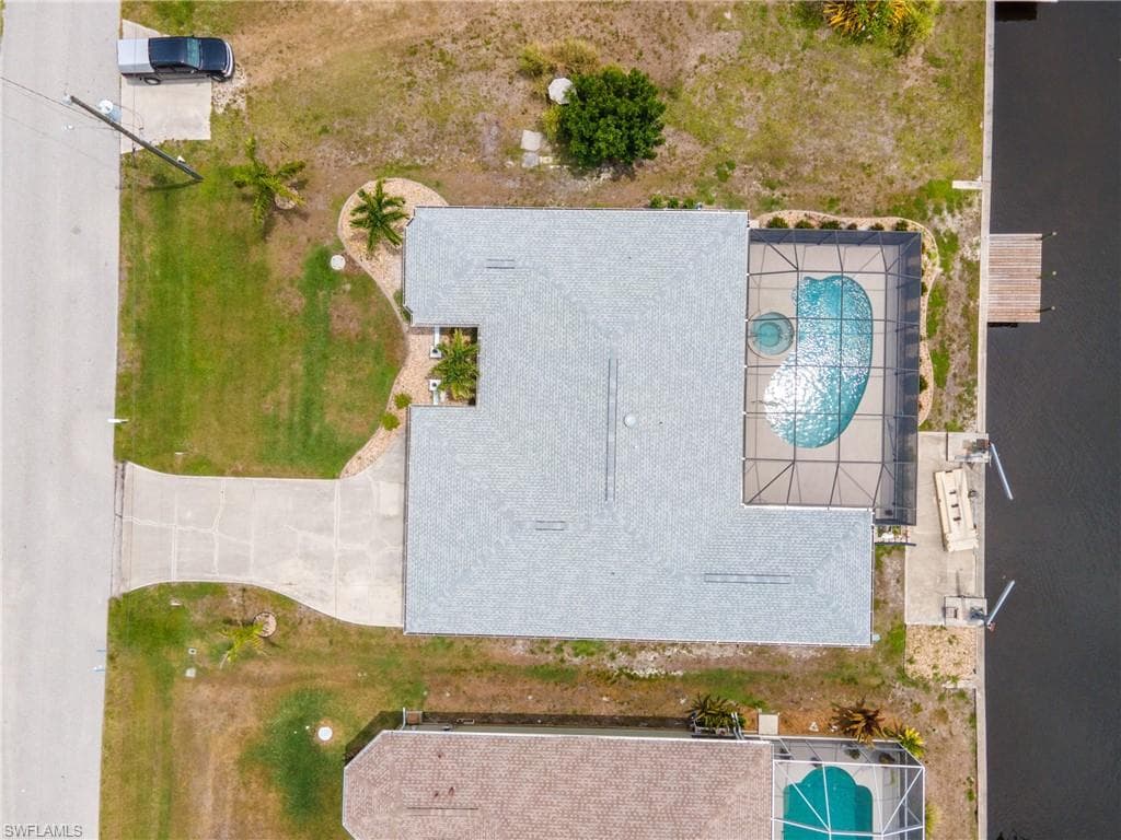 House with a screened pool, spa, and private boat dock