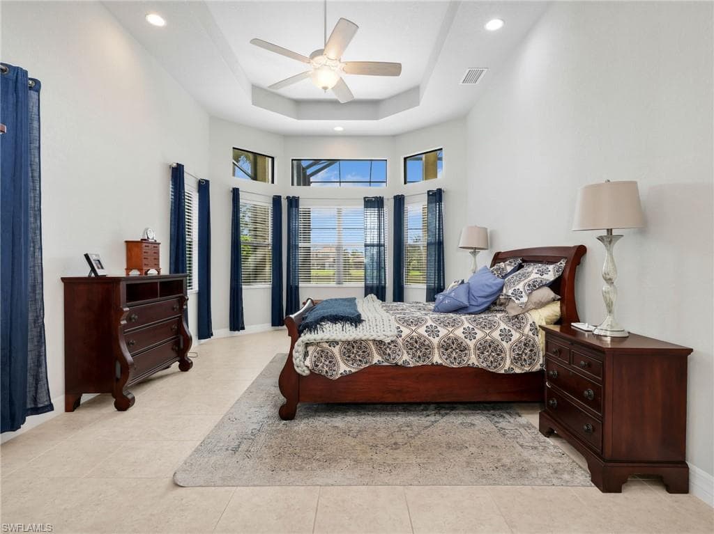 Master Bedroom featuring a bay window, recessed lighting, and a ceiling fan