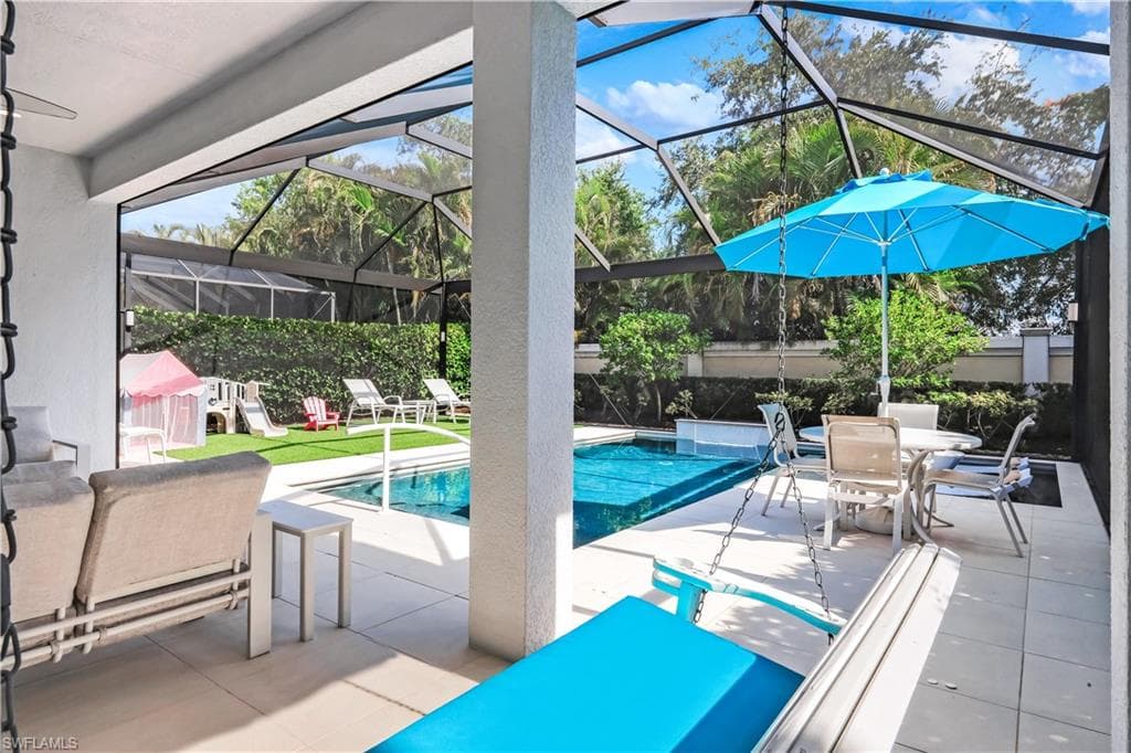Fabulous lanai with under cover area, large pool, lounge area, electric hurricane screens and built-in kitchen (not shown).