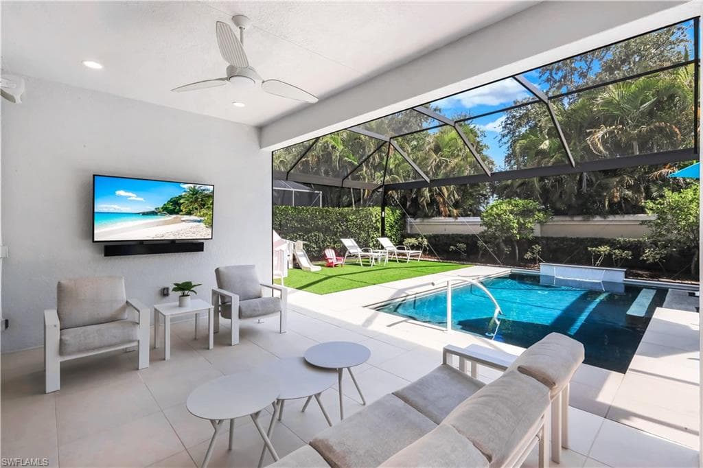 Fabulous lanai with under cover area, large pool, lounge area, electric hurricane screens and built-in kitchen (not shown).